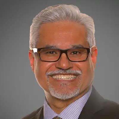 Dr. César De León